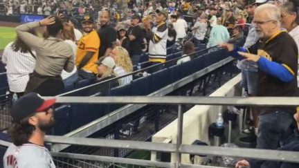 Washington Nationals outfielder Jesse Winker argues with Padres fan